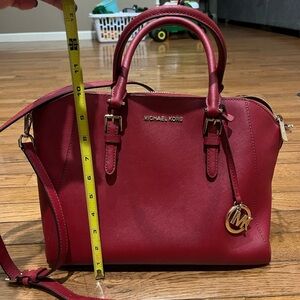 Micheal Kors purse. Bigger-medium, red, and cute! Lots of inside pockets!!